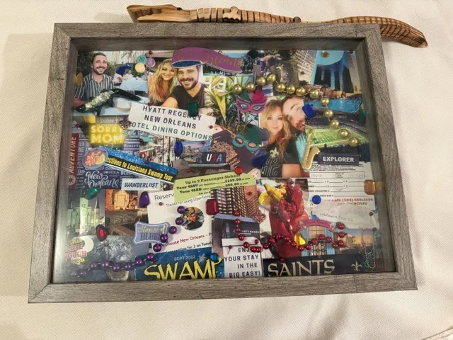 A framed Memory Box filled with photos, tickets, beads, and keepsakes from a New Orleans trip